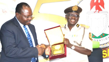 (L-r) Barrister Chris Onyemenam, DG/CEO of NIMC with David Parradang, comptroller-general of the NIS during NIMC management’s visit to NIS in Abuja, recently.